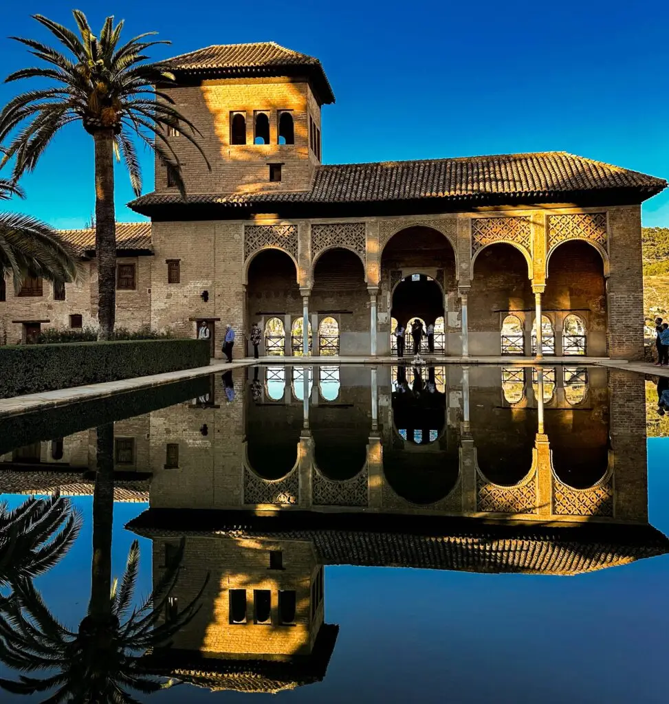 One of the palace buildings in Granada, with its reflection perfectly matched in the water.