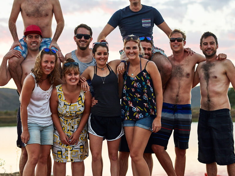 A group of travelers smiling together.